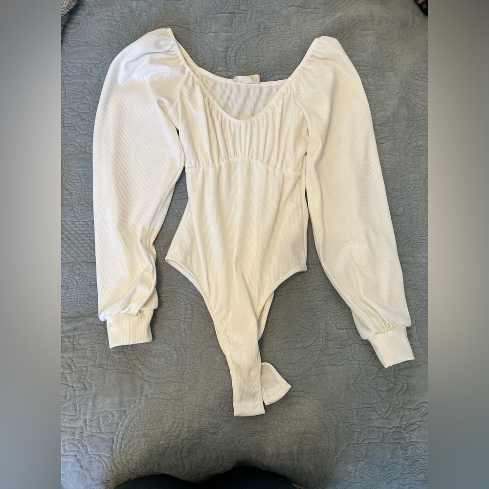 Never used, cute, cream body suit.